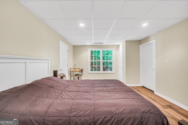 186 Ashley Dr, Mcdonough, GA 30252 - bedroom featuring wood finished floors, recessed lighting, and a paneled ceiling