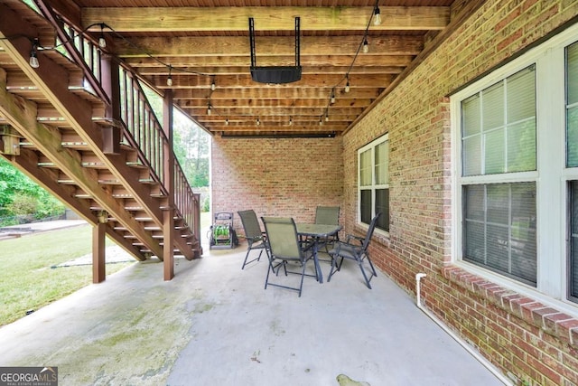 186 Ashley Dr, Mcdonough, GA 30252 - view of patio with stairway and outdoor dining space