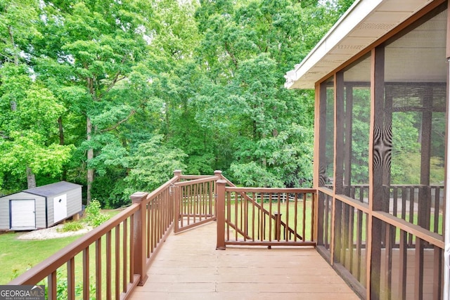 186 Ashley Dr, Mcdonough, GA 30252 - wooden terrace with a storage unit and a sunroom