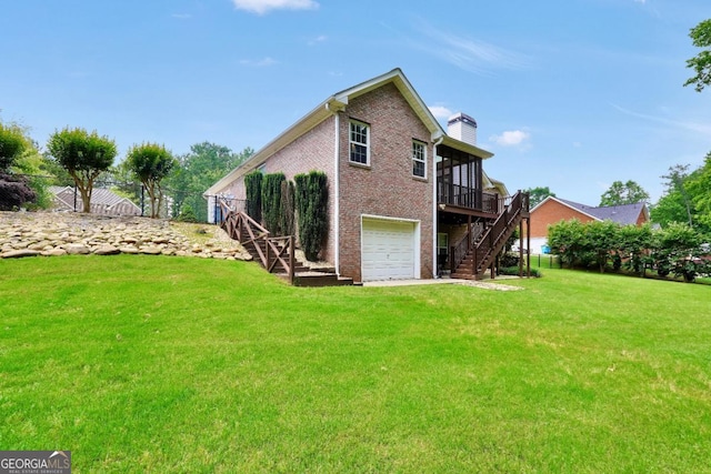 186 Ashley Dr, Mcdonough, GA 30252 - rear view of house with stairway, brick siding, a chimney, an attached garage, and a deck