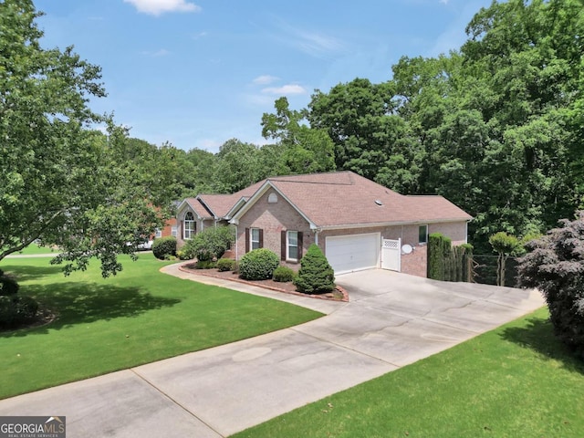 186 Ashley Dr, Mcdonough, GA 30252 - single story home featuring brick siding, driveway, a front lawn, and an attached garage