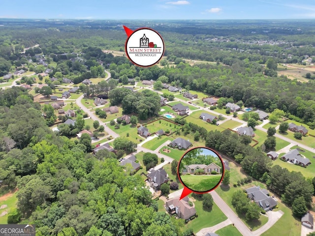 186 Ashley Dr, Mcdonough, GA 30252 - aerial perspective of suburban area featuring a forest