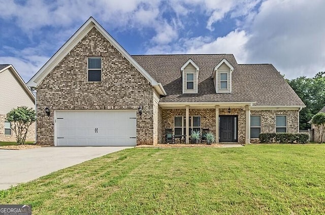 1013 Marion Oaks Dr, Macon, GA 31216 - view of front of property featuring brick siding, driveway, a front lawn, and covered porch