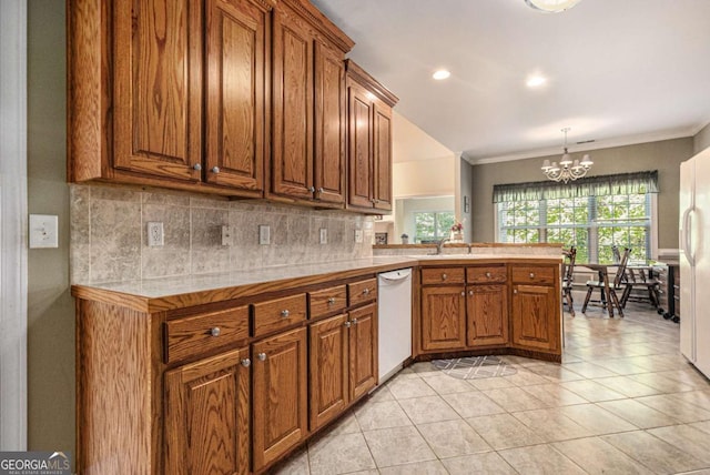 4110 Summit Chase, Gainesville, GA 30506 - kitchen with white appliances, brown cabinetry, a chandelier, backsplash, and crown molding