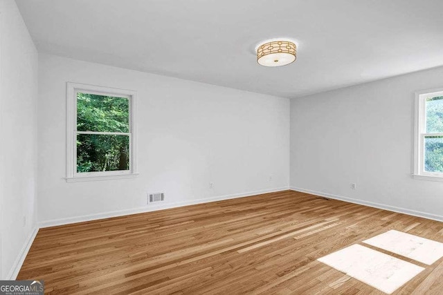 2585 Regency Dr E, Tucker, GA 30084 - unfurnished room featuring wood finished floors and baseboards
