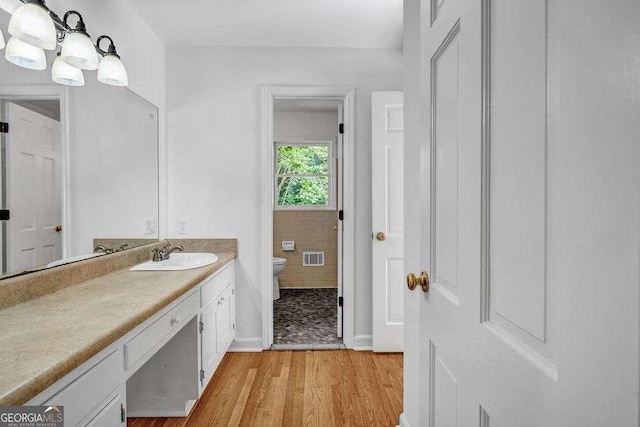 2585 Regency Dr E, Tucker, GA 30084 - bathroom with vanity and wood finished floors