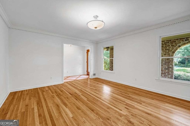 2585 Regency Dr E, Tucker, GA 30084 - empty room featuring light wood-type flooring and ornamental molding
