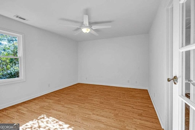 2585 Regency Dr E, Tucker, GA 30084 - spare room featuring light wood-style flooring and ceiling fan