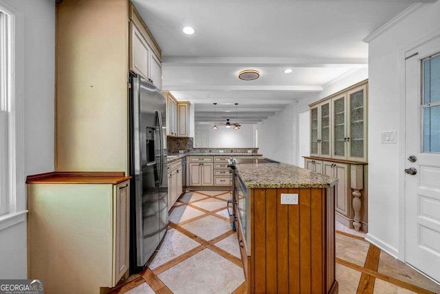 2585 Regency Dr E, Tucker, GA 30084 - kitchen featuring inlaid floor details, stainless steel fridge with ice dispenser, a peninsula, cream cabinetry, and recessed lighting
