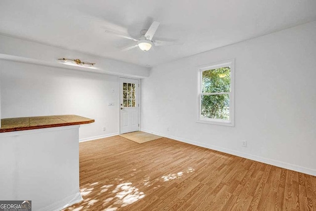 2585 Regency Dr E, Tucker, GA 30084 - spare room featuring light wood-style floors and ceiling fan
