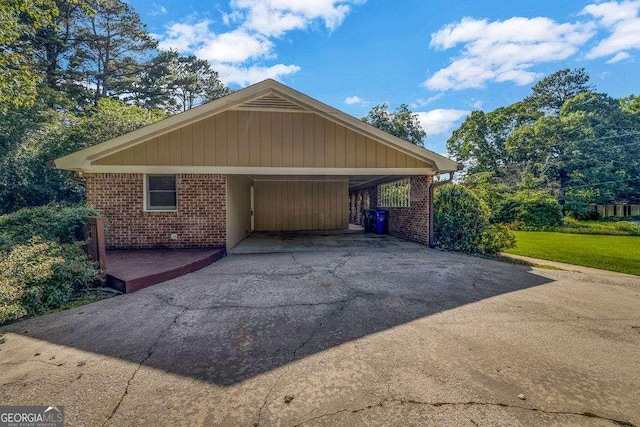 2585 Regency Dr E, Tucker, GA 30084 - garage with driveway and a carport