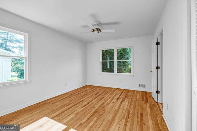 2585 Regency Dr E, Tucker, GA 30084 - unfurnished room featuring light wood-style flooring and ceiling fan