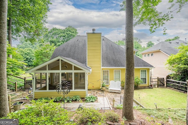 1805 Millstone Ct, Alpharetta, GA 30004 - back of property featuring a sunroom, a patio, a shingled roof, and a chimney