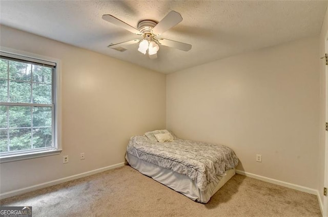 5385 Spotted Fawn Ct, Suwanee, GA 30024 - bedroom with carpet, ceiling fan, and a textured ceiling