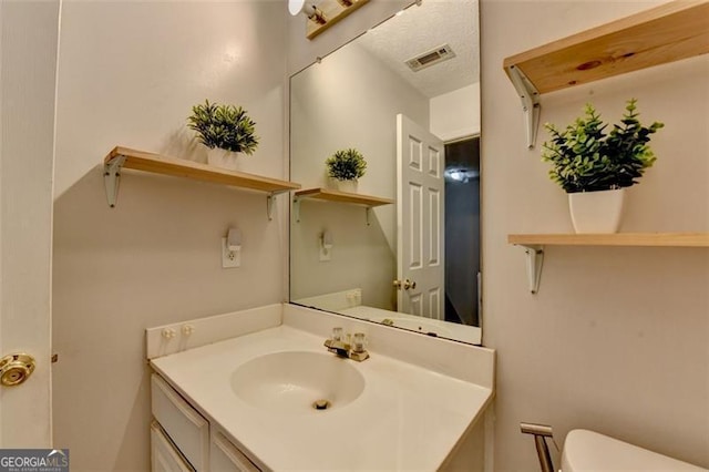 5385 Spotted Fawn Ct, Suwanee, GA 30024 - half bath with vanity and toilet