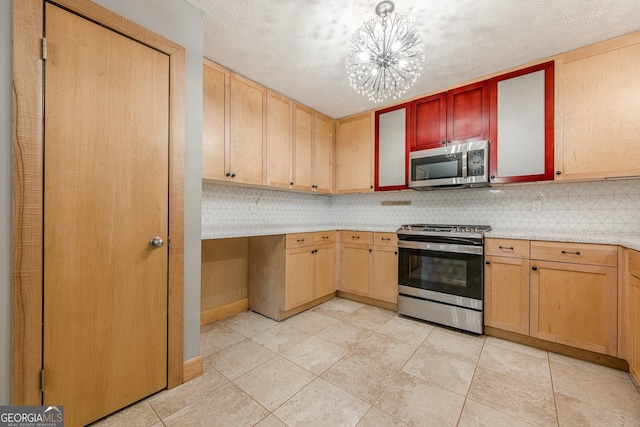 5868 Kingswood Ct NW, Norcross, GA 30093 - kitchen featuring stainless steel appliances, light countertops, decorative backsplash, a chandelier, and light brown cabinets
