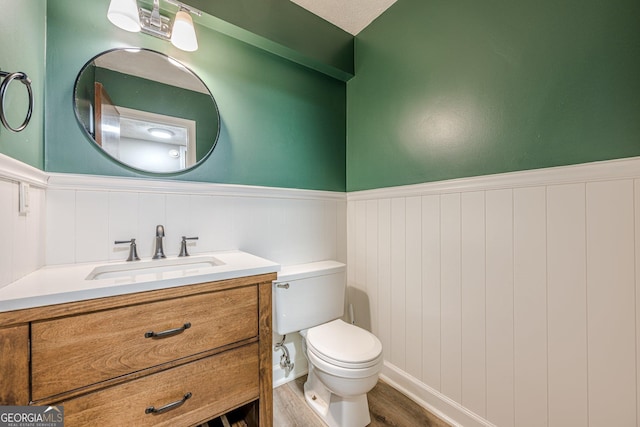 5868 Kingswood Ct NW, Norcross, GA 30093 - bathroom featuring wainscoting, vanity, and wood finished floors