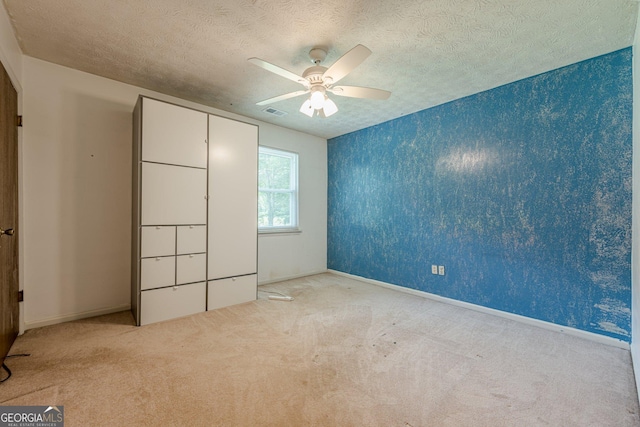 5868 Kingswood Ct NW, Norcross, GA 30093 - unfurnished bedroom with carpet, a textured ceiling, and ceiling fan