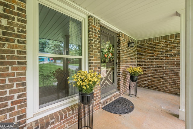 5868 Kingswood Ct NW, Norcross, GA 30093 - doorway to property featuring brick siding and a porch