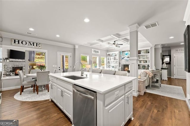 2213 Independence Ln, Buford, GA 30519 - kitchen with a lit fireplace, stainless steel dishwasher, open floor plan, ceiling fan, and coffered ceiling