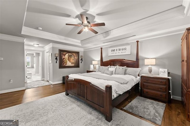 2213 Independence Ln, Buford, GA 30519 - bedroom featuring a raised ceiling, wood finished floors, ornamental molding, ensuite bath, and ceiling fan