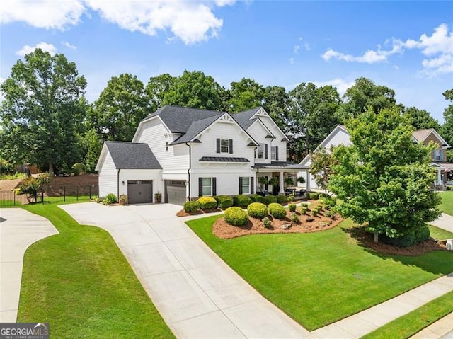 2213 Independence Ln, Buford, GA 30519 - modern farmhouse with driveway, a garage, and a standing seam roof
