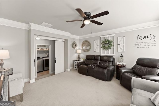 2213 Independence Ln, Buford, GA 30519 - living room featuring light colored carpet, a ceiling fan, ornamental molding, and washing machine and clothes dryer