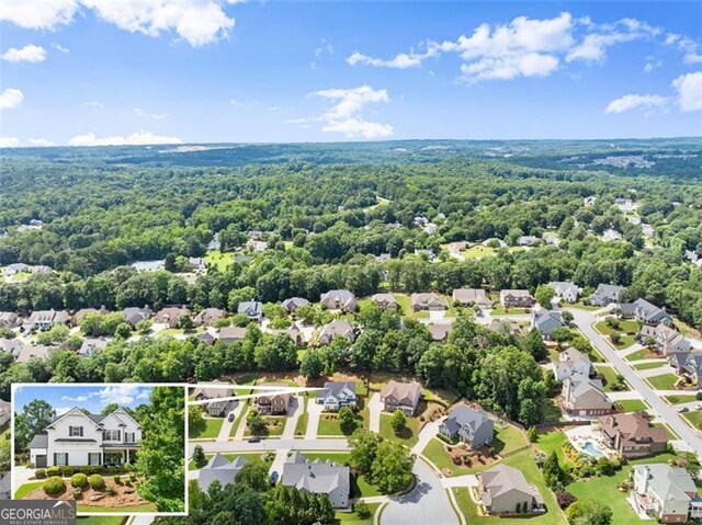 2213 Independence Ln, Buford, GA 30519 - aerial view of residential area with property parcel outlined and a heavily wooded area