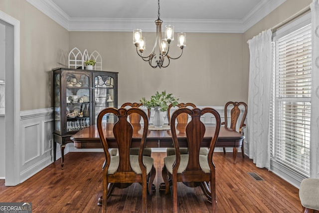 1120 Liberty Ln, Bogart, GA 30622 - dining space featuring a chandelier, wood finished floors, and ornamental molding