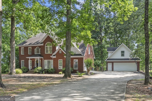 1120 Liberty Ln, Bogart, GA 30622 - view of front of home with brick siding, driveway, and an attached garage