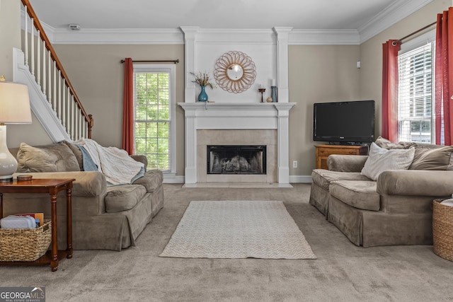 1120 Liberty Ln, Bogart, GA 30622 - carpeted living area featuring ornamental molding, a tile fireplace, and stairway