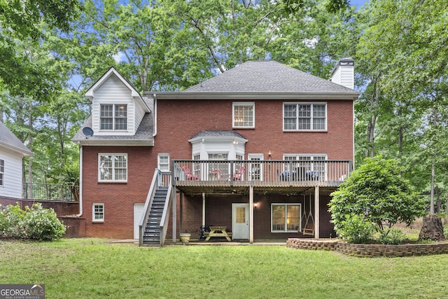 1120 Liberty Ln, Bogart, GA 30622 - rear view of house with a chimney, stairway, a deck, brick siding, and a lawn