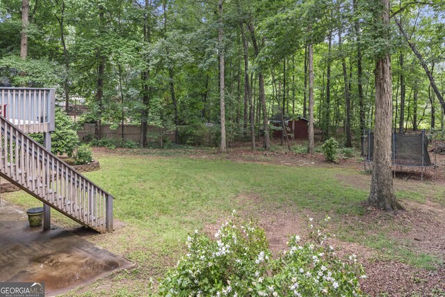 1120 Liberty Ln, Bogart, GA 30622 - view of yard featuring a trampoline and stairs