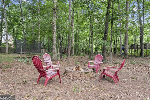 1120 Liberty Ln, Bogart, GA 30622 - view of yard featuring an outdoor fire pit and a trampoline