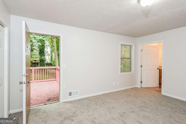 1024 Stone Mill Run, Lawrenceville, GA 30046 - empty room with carpet and a textured ceiling