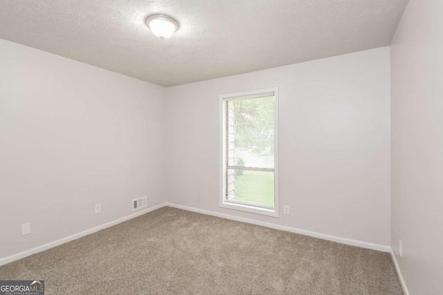 1024 Stone Mill Run, Lawrenceville, GA 30046 - carpeted empty room featuring baseboards and a textured ceiling