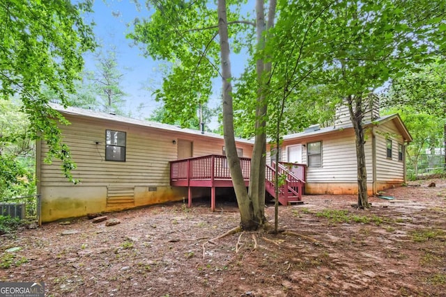 1024 Stone Mill Run, Lawrenceville, GA 30046 - back of property featuring crawl space, a wooden deck, and stairs
