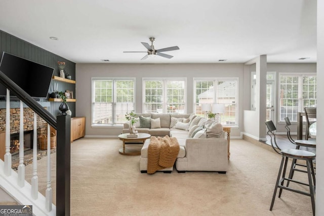 2000 Settindown Dr, Roswell, GA 30075 - living room featuring a ceiling fan, light carpet, and stairway