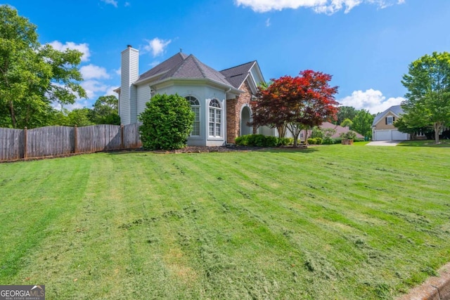 2000 Settindown Dr, Roswell, GA 30075 - view of property exterior with a chimney and stucco siding