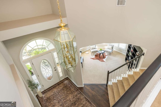 2000 Settindown Dr, Roswell, GA 30075 - entryway featuring a towering ceiling, wood finished floors, and stairway