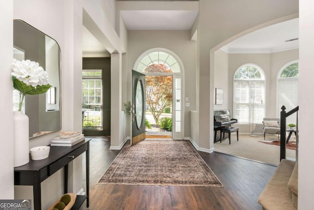 2000 Settindown Dr, Roswell, GA 30075 - foyer entrance featuring arched walkways, dark wood-type flooring, and crown molding