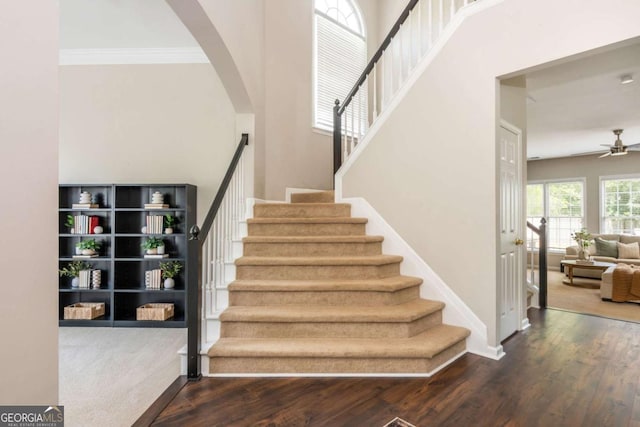 2000 Settindown Dr, Roswell, GA 30075 - stairway featuring arched walkways, wood finished floors, ceiling fan, and ornamental molding