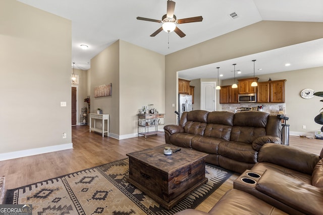 206 Barnyard Way, Perry, GA 31069 - living room featuring ceiling fan, wood finished floors, lofted ceiling, and recessed lighting
