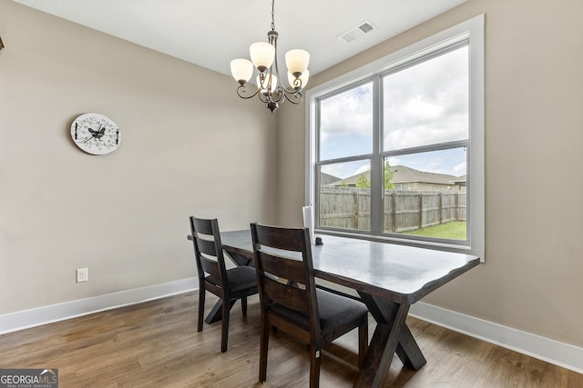 206 Barnyard Way, Perry, GA 31069 - dining space featuring a chandelier and wood finished floors