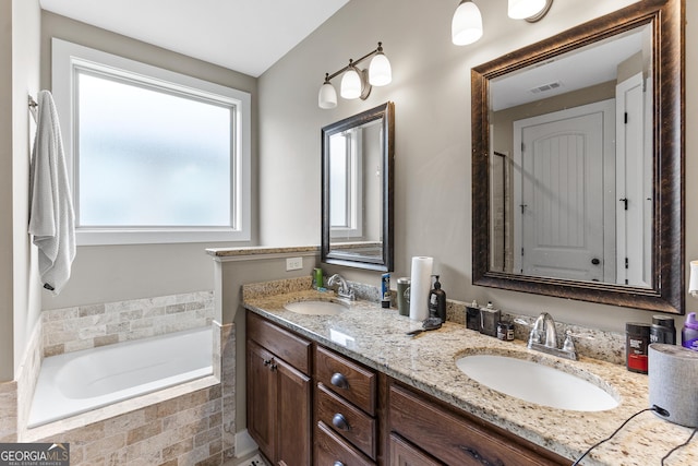 206 Barnyard Way, Perry, GA 31069 - full bathroom with double vanity and a garden tub