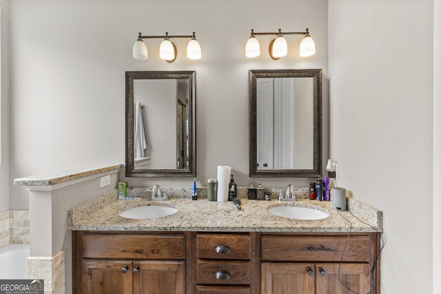 206 Barnyard Way, Perry, GA 31069 - bathroom with double vanity and a bathtub