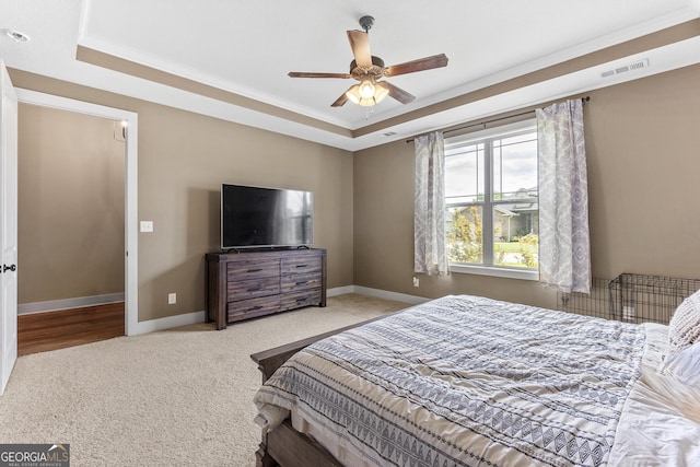 206 Barnyard Way, Perry, GA 31069 - bedroom featuring a tray ceiling, carpet floors, crown molding, and ceiling fan