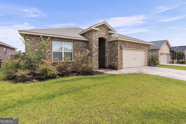 206 Barnyard Way, Perry, GA 31069 - view of front of property with brick siding, an attached garage, concrete driveway, and a front lawn
