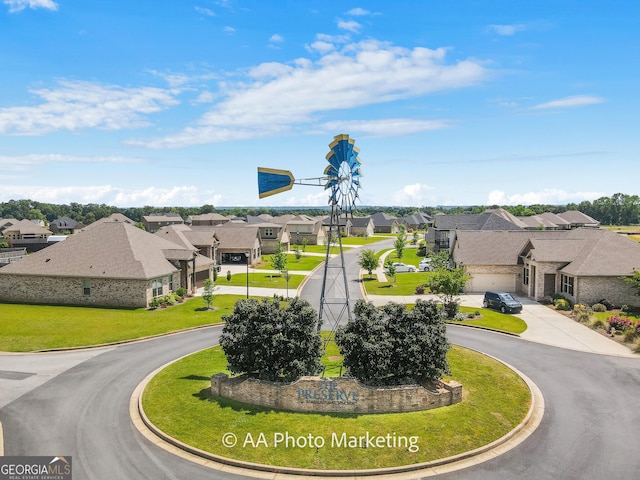 206 Barnyard Way, Perry, GA 31069 - view of community with a residential view, curved driveway, and a yard