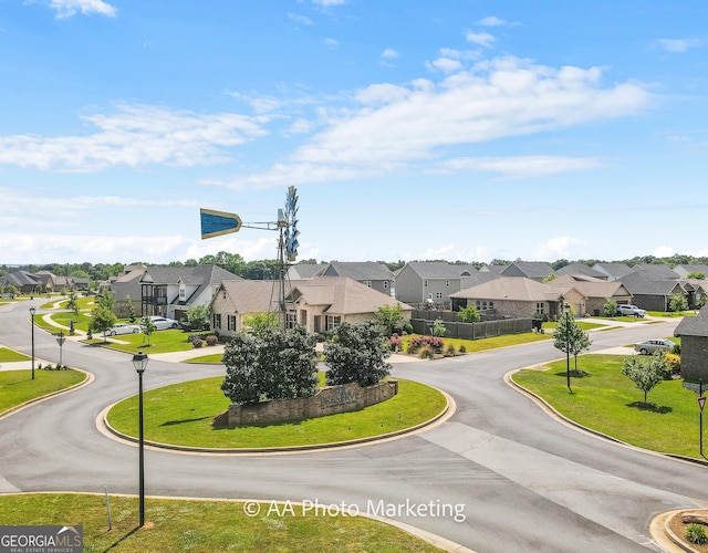 206 Barnyard Way, Perry, GA 31069 - view of asphalt road with a residential view, street lighting, and curbs